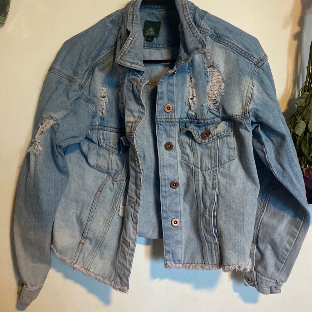 Wild Fable, sized medium women’s ripped blue Jean jacket.